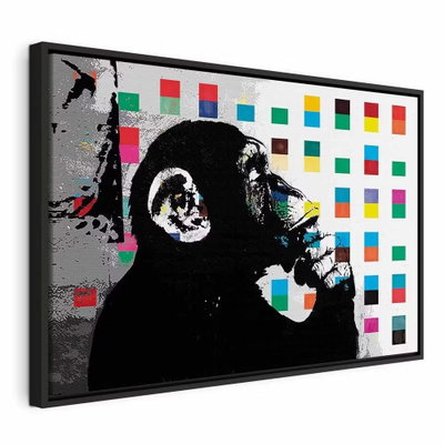 Banksy the thinker monkey – svart ram. En svartvit apfigur i profil håller handen vid munnen framför små rutor i klara färger.