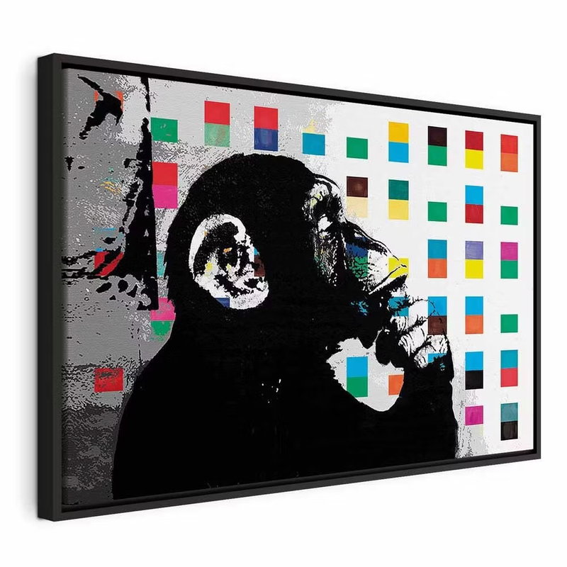 Banksy the thinker monkey – svart ram. En svartvit apfigur i profil håller handen vid munnen framför små rutor i klara färger.