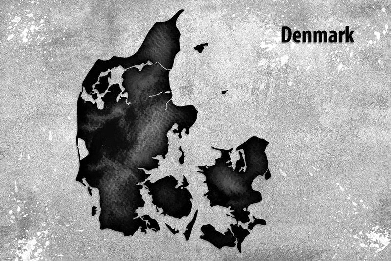 Scandinavian beauty: En svart silhuett av Danmark med ljusa skiftningar möter en gråvit bakgrund och texten Denmark.