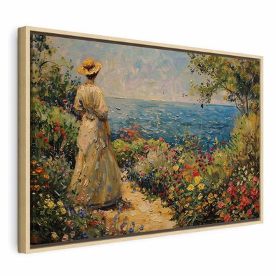 Nostalgic impression a – naturfärgad ram. En figur i ljusa kläder står bland färgrika blommor och blickar mot blått vatten.