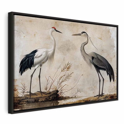 Birds from an old engraving – svart ram. Två stora långbenta fåglar med vita, grå och mörka fjädrar står bland torra kvistar mot åldrad beige botten.