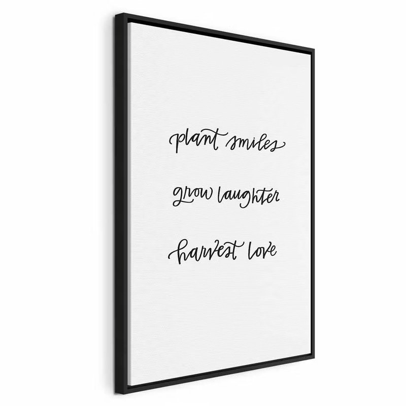 Joy and love vertical – svart ram. Orden plant smiles grow laughter harvest love står i tre luftiga rader med svart handskriftsliknande stil på vitt.