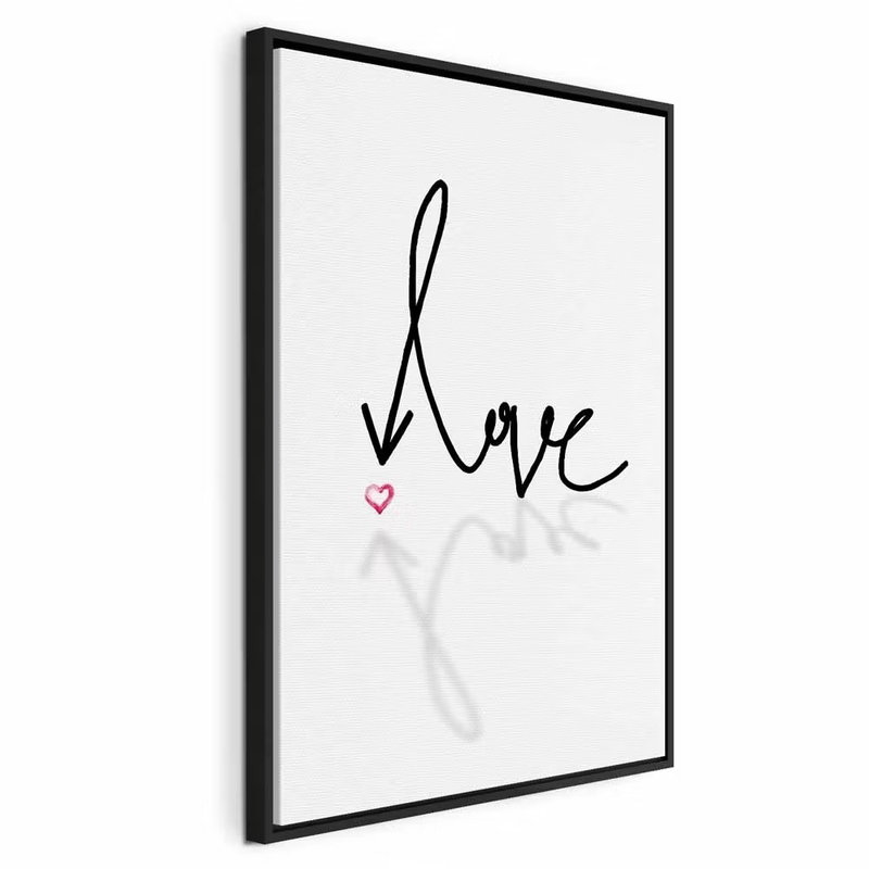 This is love vertical – svart ram. Handskriftsliknande svart typografi och ett rosa hjärta bildar ett enkelt textmotiv på vit botten.