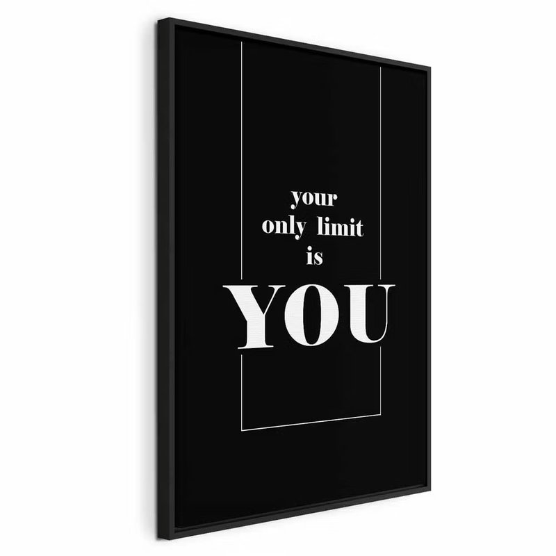 Key to success black and – svart ram. Vit typografi med orden your only limit is YOU framträder inom en tunn bård på svart.