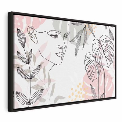 The wildness of a woman – svart ram. Ett kvinnligt ansikte tecknas med tunna linjer bland botaniska bladformer i blekt rosa och grått.