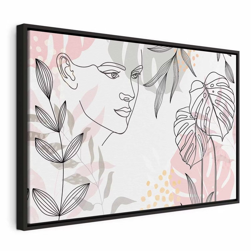 The wildness of a woman – svart ram. Ett kvinnligt ansikte tecknas med tunna linjer bland botaniska bladformer i blekt rosa och grått.
