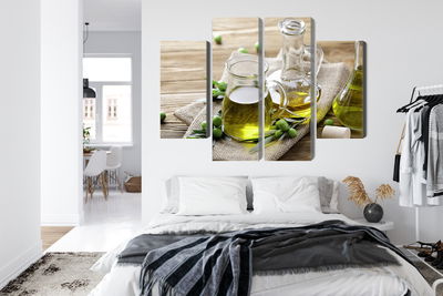 Ljuddämpande tavla - Olive oil with green olives