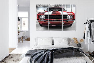 Ljuddämpande tavla - A red muscle car in a garage