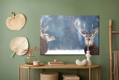Ljuddämpande tavla - Two deer in the winter forest