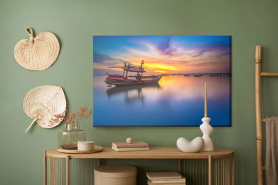 Ljuddämpande tavla - Boat at sunset